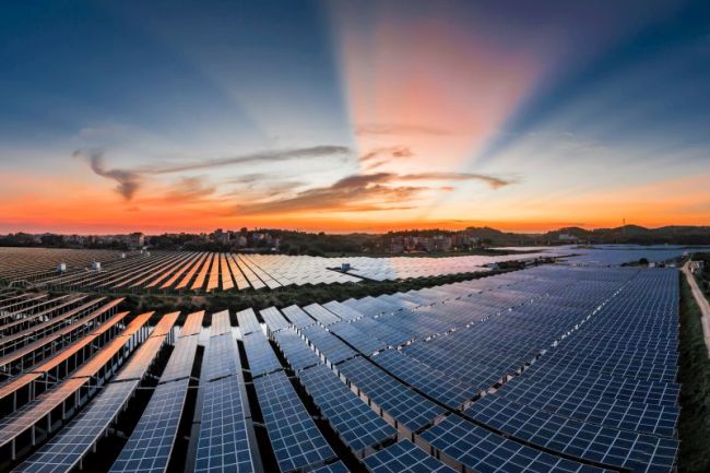 A solar power plant in a beautiful sunset